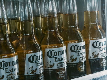 a refrigerator filled with lots of bottles of beer
